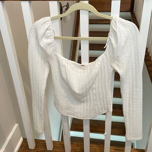 Worn once super cute and flattering white long sleeved from free people